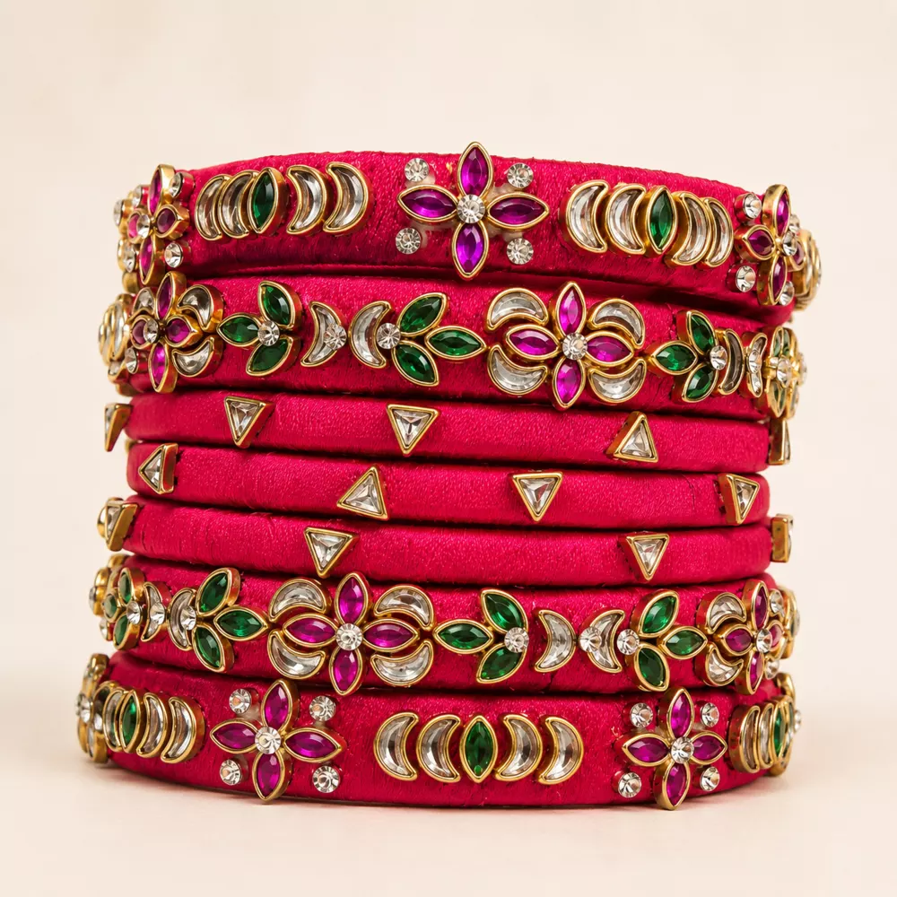 Close-up of a magenta festive silk thread bangle set.
