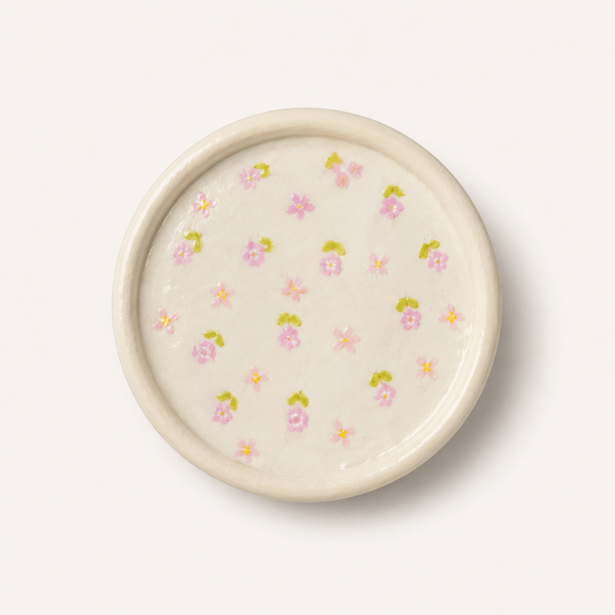 Cream floral trinket tray styled for an inspiration board.