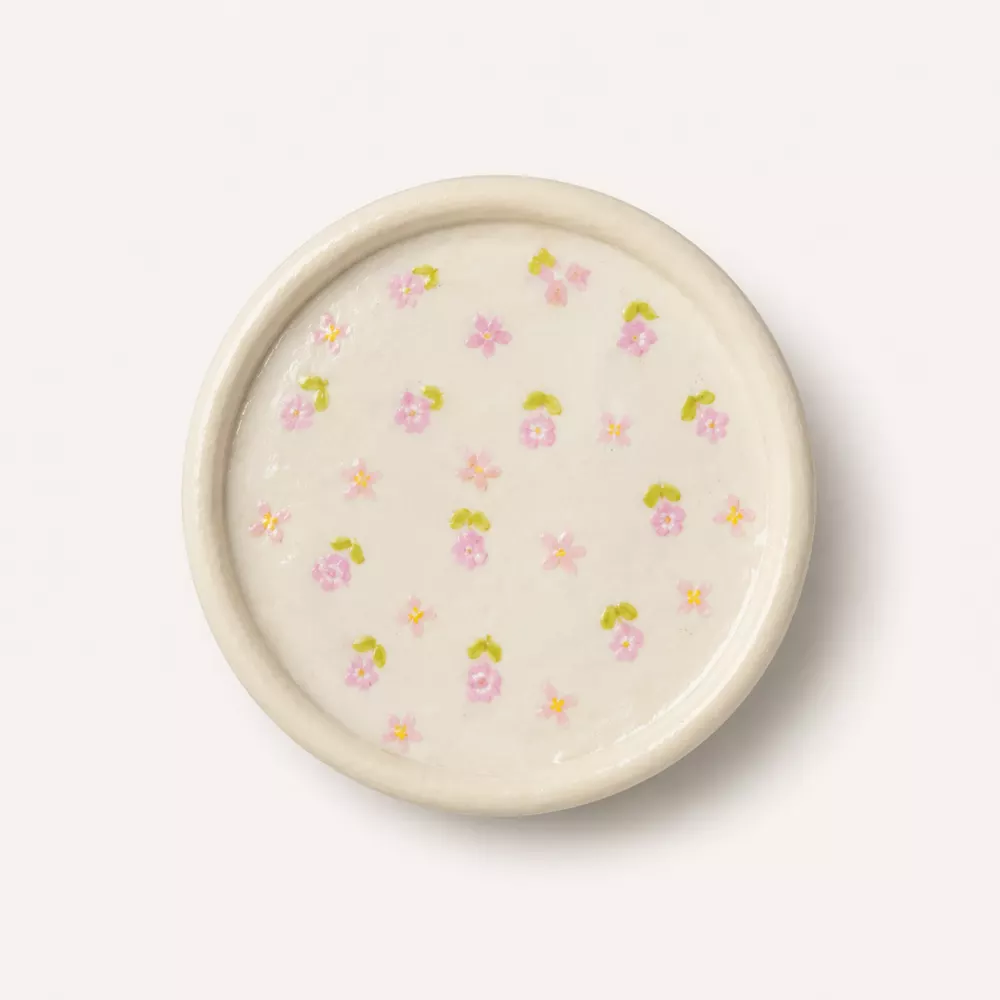 Cream floral trinket tray styled for an inspiration board.